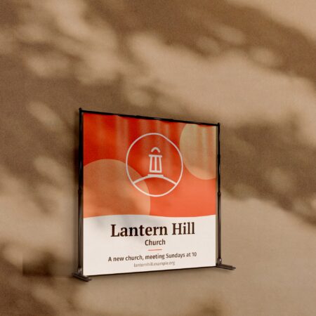 Telescopic backdrop banner stand with a Lantern Hill Church sample design