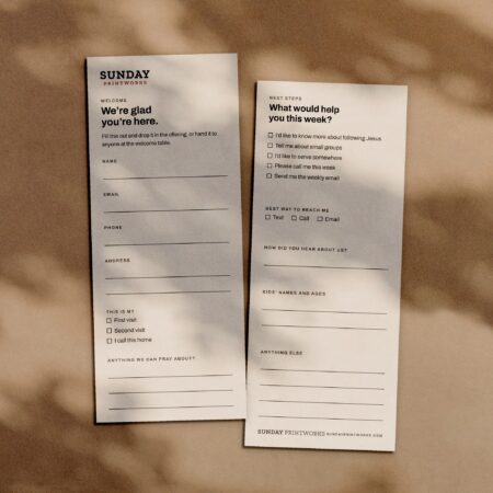 Connection cards, front and back, in window light