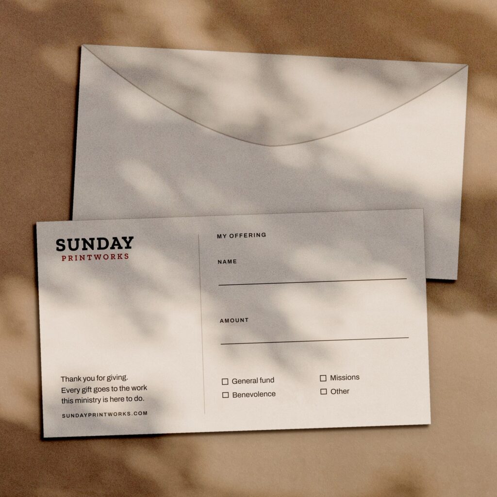 Giving envelopes, front and back, in window light