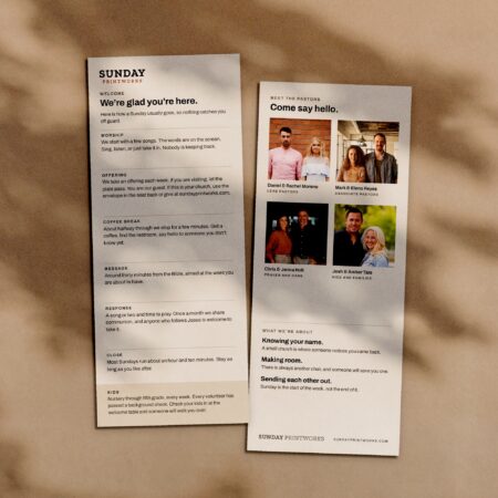 Guest info cards, front and back, in window light